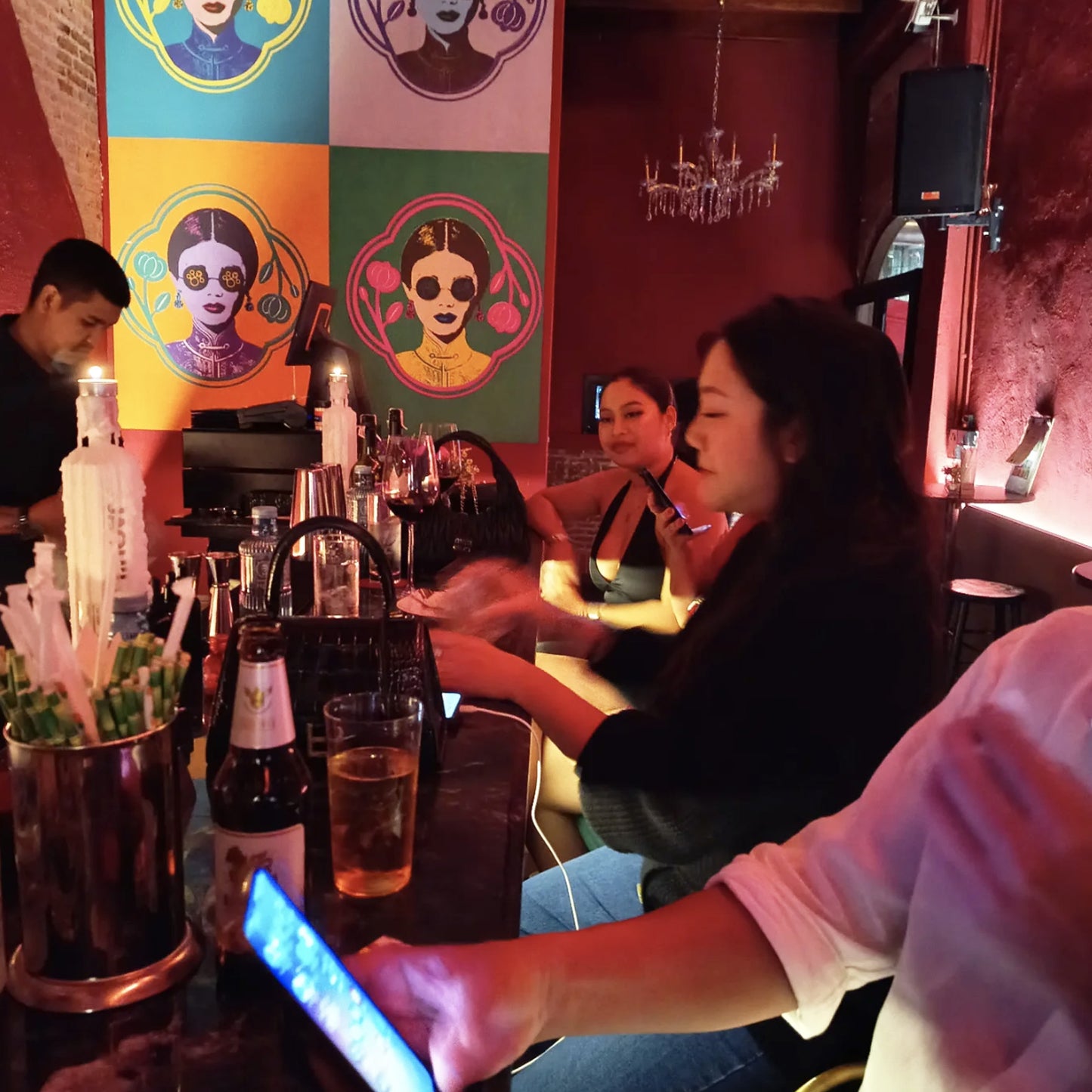 Guests enjoying drinks at trendy Bangkok speakeasy bar on TukMe tuk tuk bar hopping tour