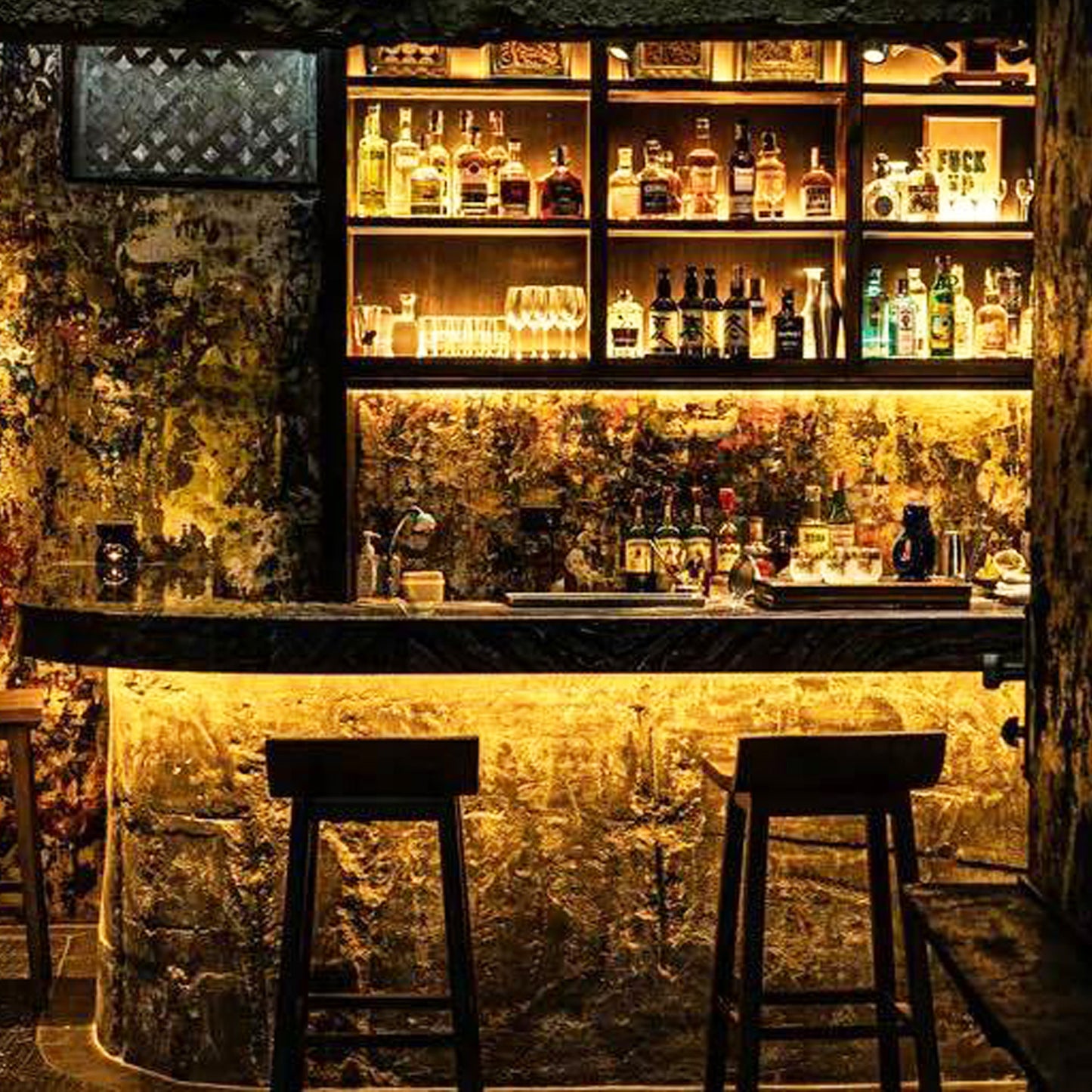 Luxury speakeasy bar interior with premium spirits shelf in Bangkok during TukMe tuk tuk nightlife tour