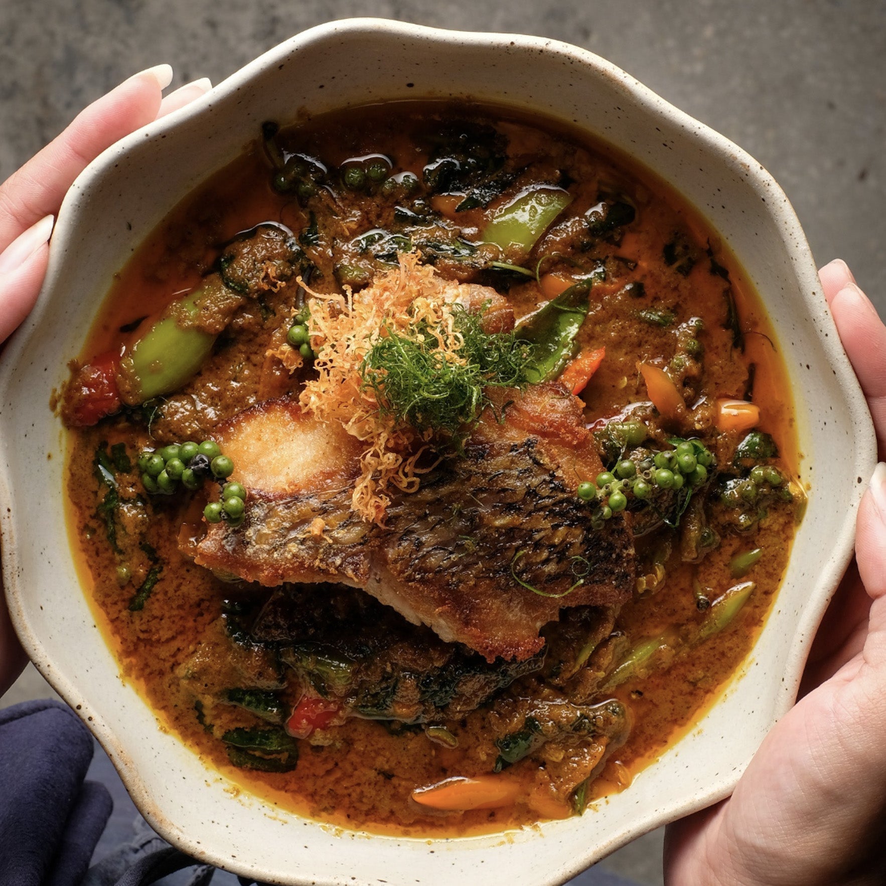 Traditional Thai spicy fish curry dish, explore Bangkok’s culinary delights with TukMe Tuk Tuk tours