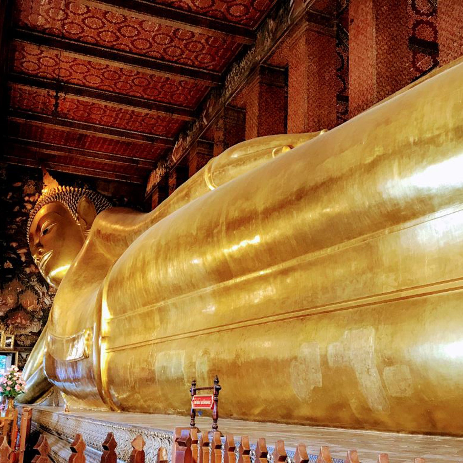 Reclining Buddha at Wat Pho in Bangkok, experience iconic sights with TukMe Tuk Tuk tours